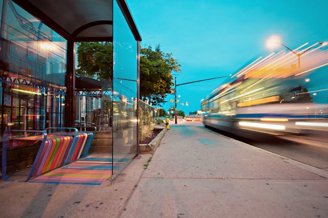 Bus stop with a rainbow bench